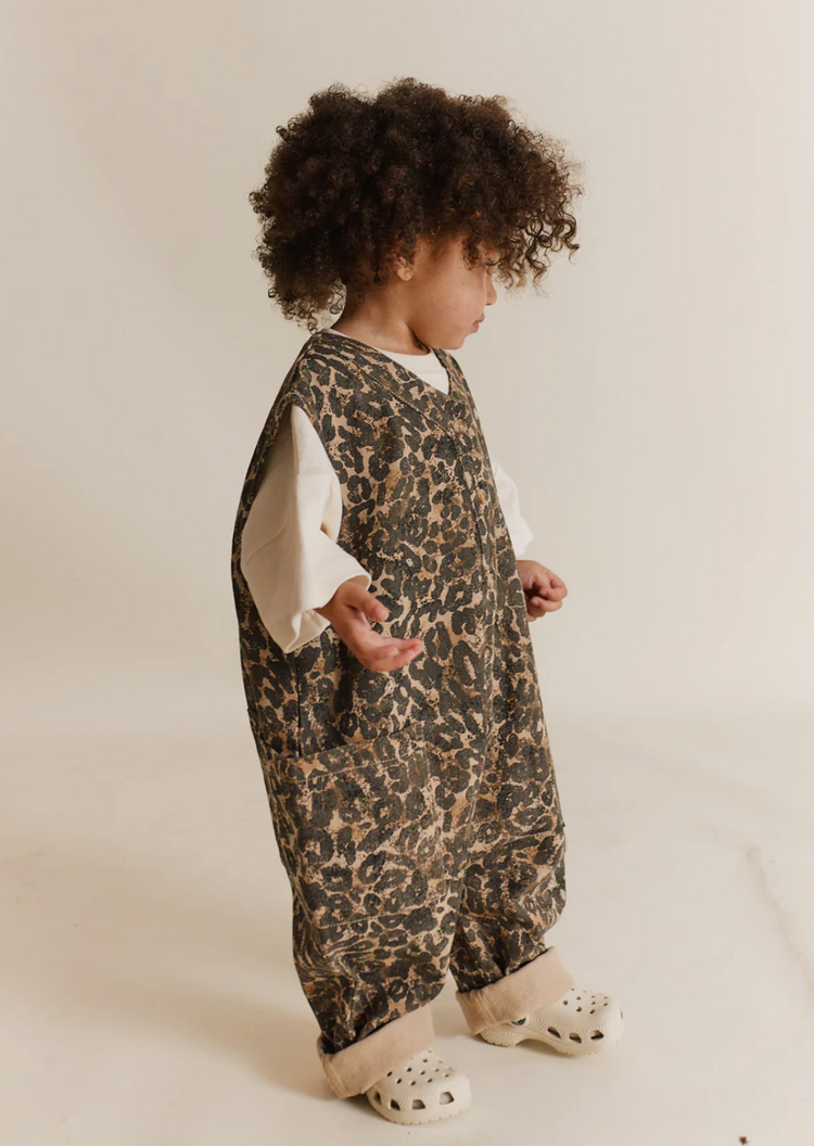 claude and co promotional image toddler in leopard onesie