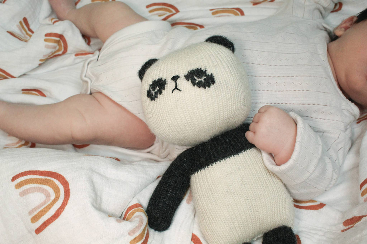Handknitted lambswool panda toy