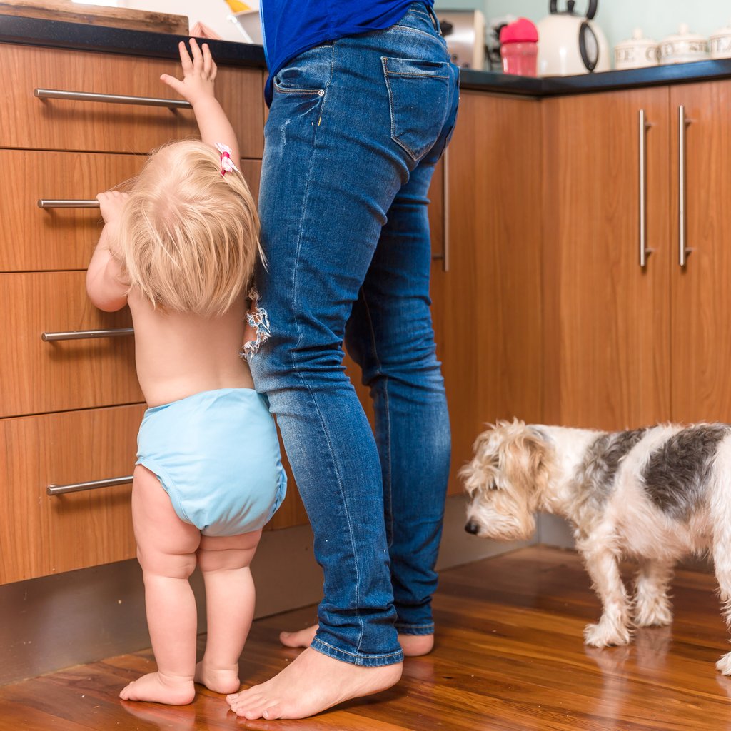 little lamb child wearing reusable cloth nappy and wrap